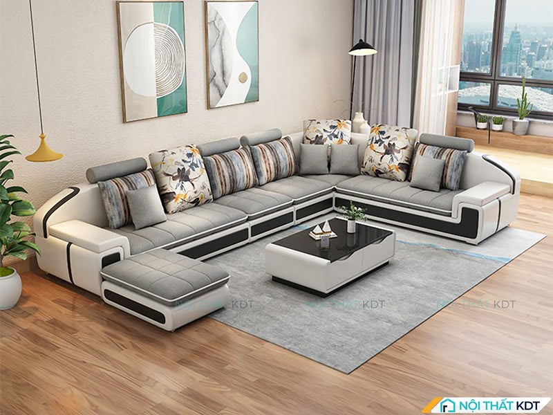 Không gian sống tinh tế với sofa xám và đèn thả màu vàng ấm áp