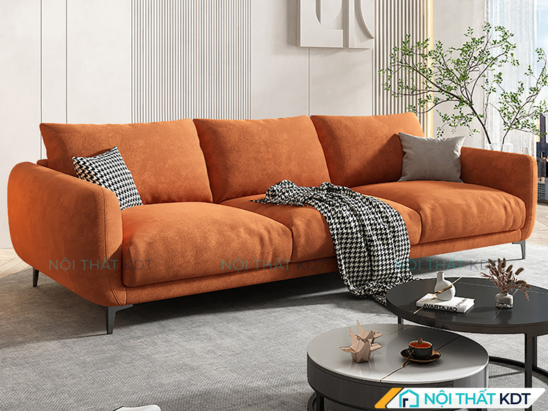 Tham khảo cách kê sofa văng 3 chỗ sát tường, đối diện với bàn trà tròn hiện đại, kết hợp thêm cây cảnh trang trí để tạo nên điểm nhấn nổi bật cho phòng khách