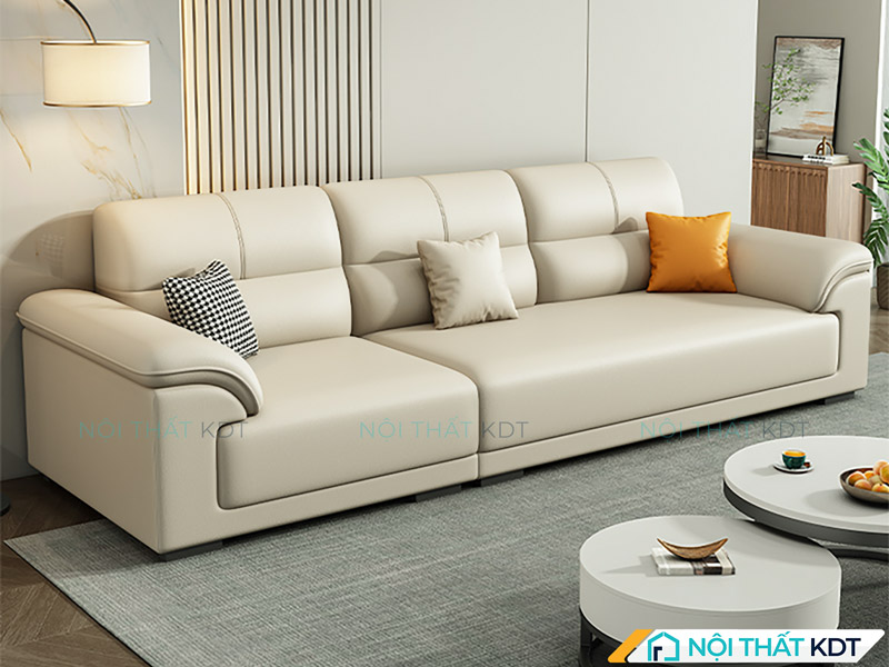 Sofa văng 3 chỗ được bố trí sát tường, đối diện với 2 bàn trà tròn, tạo nên một không gian tiếp khách rộng rãi và cân đối