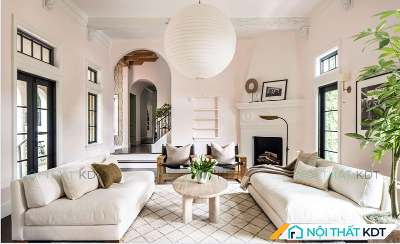 Hai sofa văng kê đối diện nhau tạo không gian tiếp khách mở