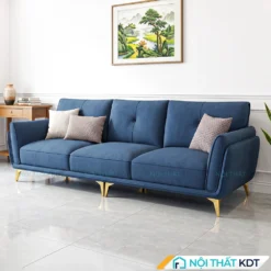 Sofa văng da S202 màu xanh blue đậm đặt cạnh bàn gỗ